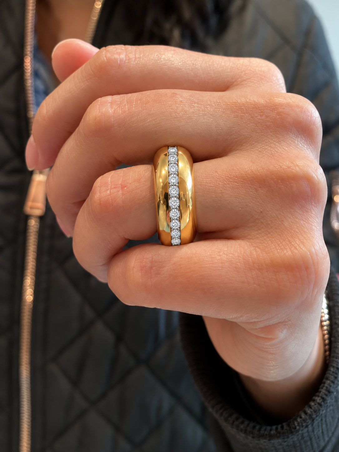 14k yellow gold Diamond Accent Band with a row of round diamonds, shown worn on a hand